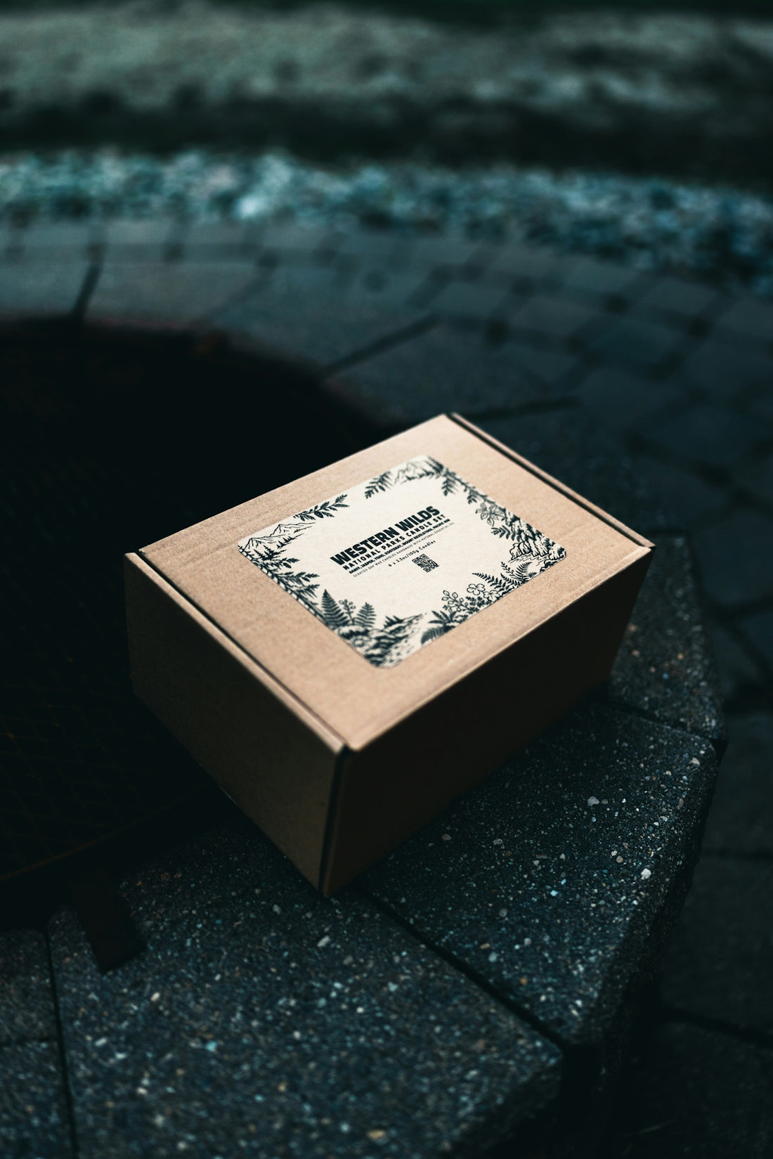 Cardboard box with a decorative label on stone